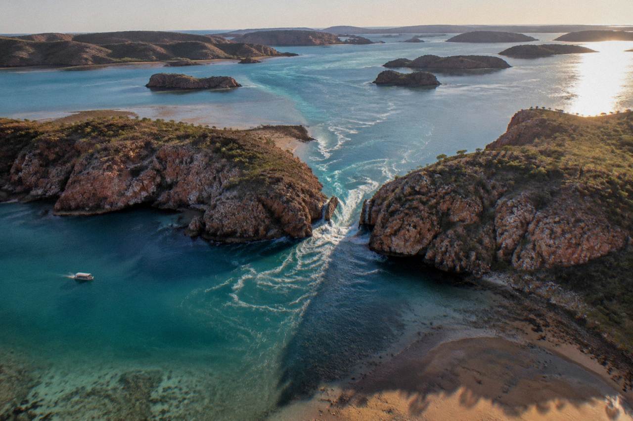 Aerial view of rugged islands and turquoise water in the Buccaneer Archipelago