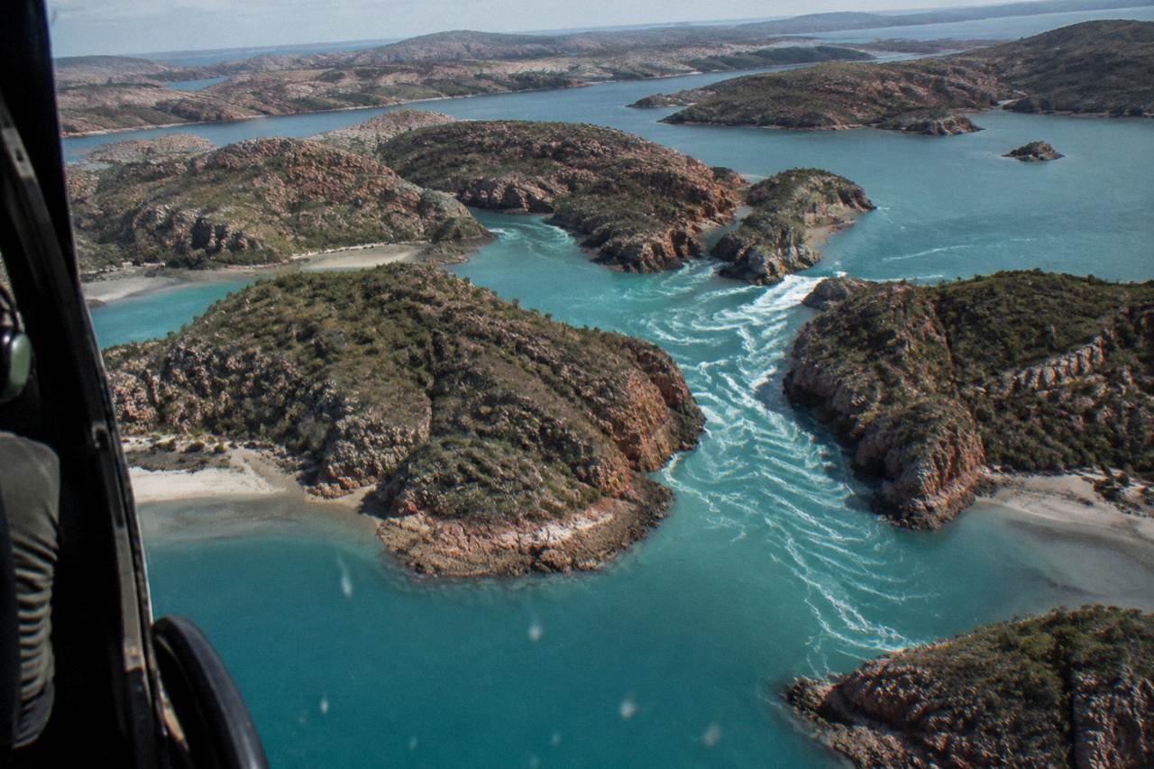 Aerial view of densely packed islands and turquoise reef channels in the Buccaneer Archipelago