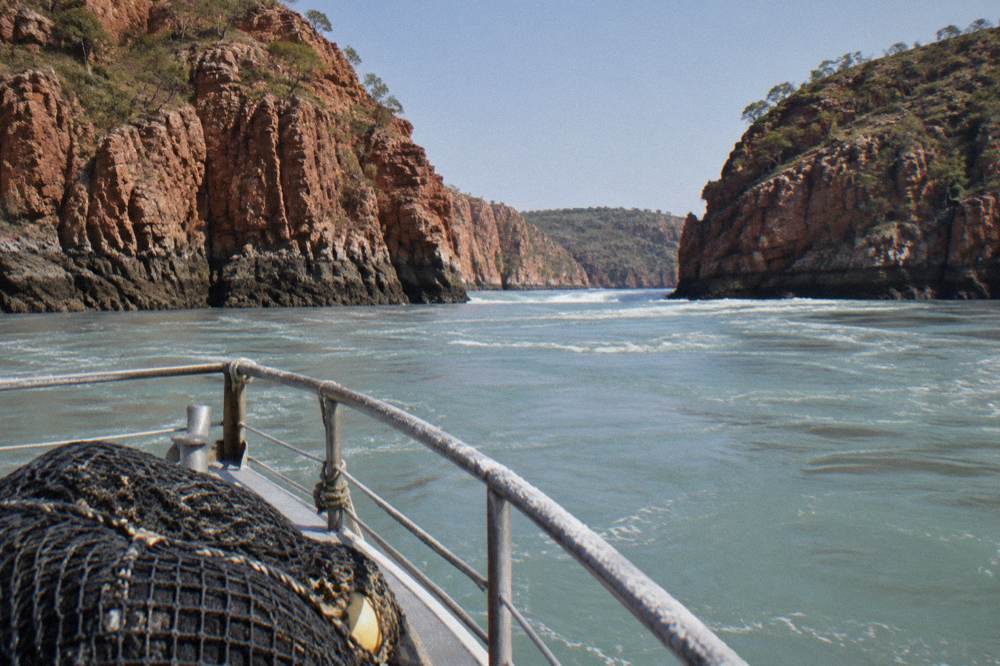 King Sound tidal boat tour with red cliffs in background