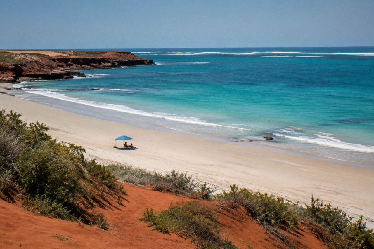 Aerial view of Broome's Cable Beach shoreline with turquoise water and a long strip of sand at midday